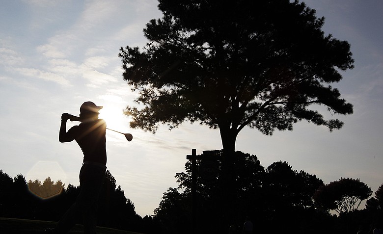 Rory McIlroy, of Northern Ireland, hits a drive on the sixth hole during a practice round for the PGA Championship golf tournament Tuesday, Aug. 9, 2011, at the Atlanta Athletic Club in Johns Creek, Ga.