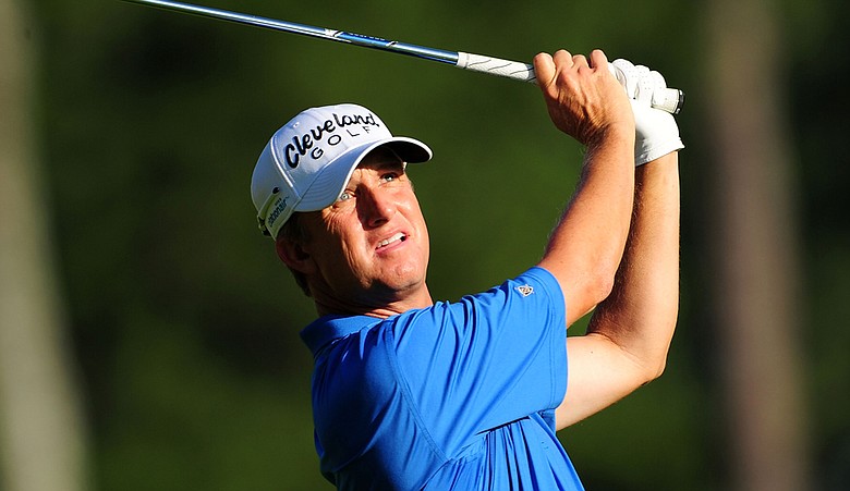 David Toms hits an approach shot on the 12th hole during the first round of the 93rd PGA Championship at the Atlanta Athletic Club.