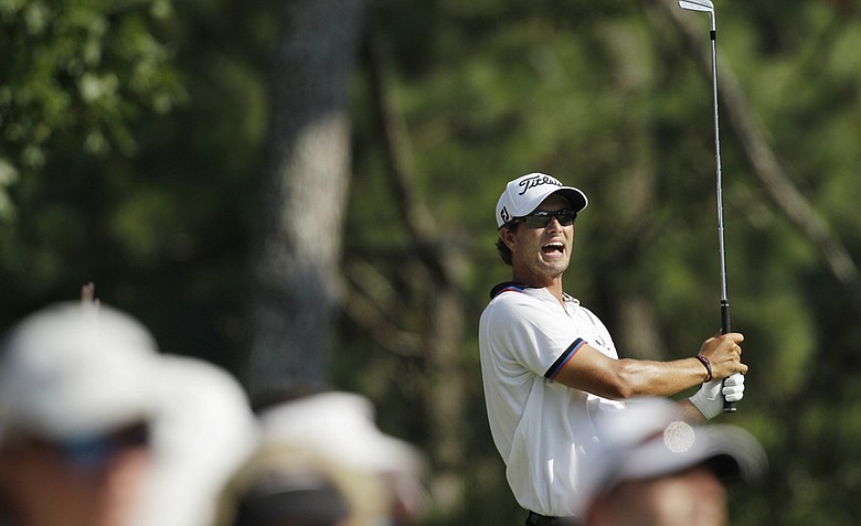 Adam Scott, of Australia, reacts to his tee shot on the 17th hole during the second round of the PGA Championship golf tournament Friday, Aug. 12, 2011, at the Atlanta Athletic Club in Johns Creek, Ga.