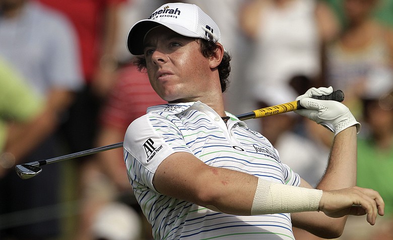 Rory McIlroy, of Northern Ireland, lets go of his club as he hits a drive on the 15th hole during the second round of the PGA Championship golf tournament Friday, Aug. 12, 2011, at the Atlanta Athletic Club in Johns Creek, Ga.