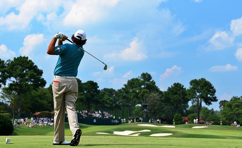 (EDITORS NOTE: A polarizing filter was used for this image.) Jason Dufner hits his tee shot on the seventh hole during the third round of the 93rd PGA Championship at the Atlanta Athletic Club on August 13, 2011 in Johns Creek, Georgia.