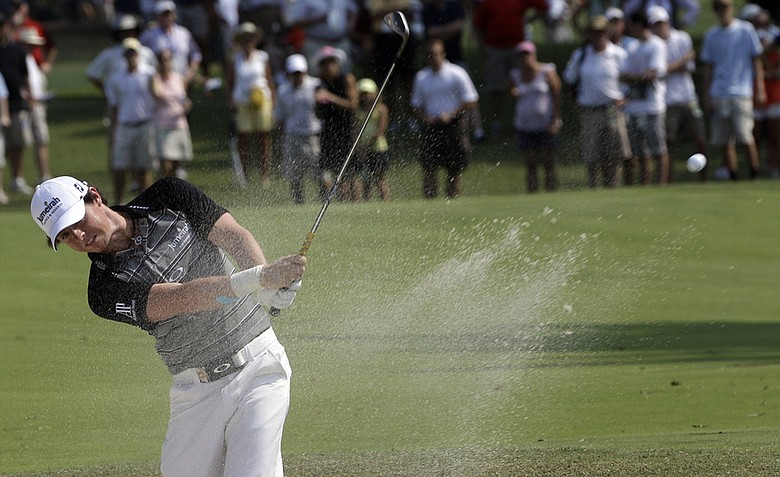 Rory McIlroy, of Northern Ireland, hits out of a bunker on the sixth hole during the third round of the PGA Championship golf tournament Saturday, Aug. 13, 2011, at the Atlanta Athletic Club in Johns Creek, Ga.