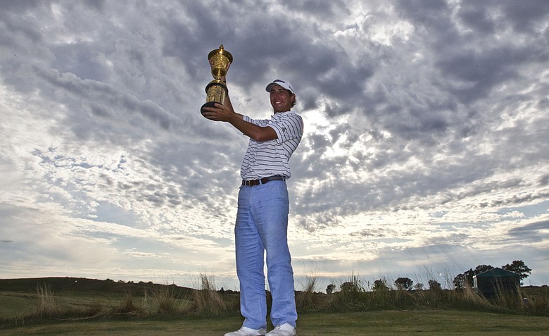 Kelly Kraft, of Denton, Texas, poses with his championship trophy after the final round at the U.S. Amateur golf tournament Sunday, Aug. 28, 2011, at Erin Hills in Erin, Wis. Kraft defeated Patrick Cantlay, of Los Alamitos, Calif., 2-up to win the tournament.