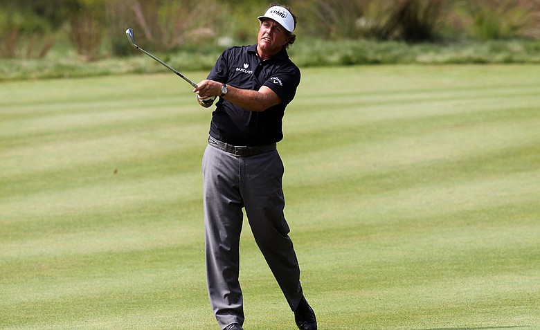 Phil Mickelson watches his approach shot from the fairway on the 18th hole during the third round of the Deutsche Bank Championship at TPC Boston on September 4, 2011 in Norton, Massachusetts.