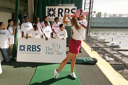 Paula Creamer hits balls during a First Tee event at Chelsea Piers.