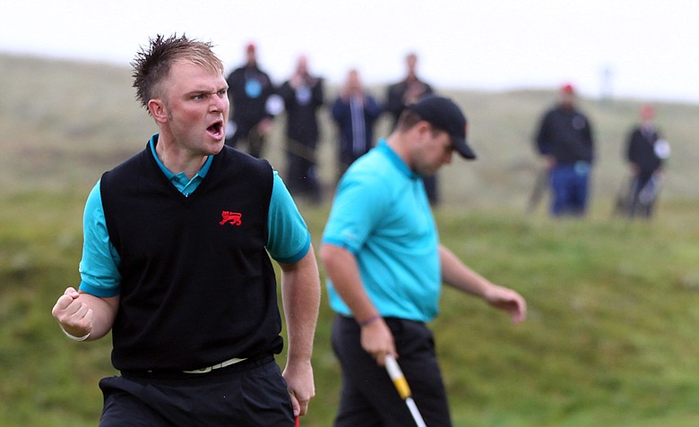 Andy Sullivan of Great Britain and Ireland celebrates a birdie putt on the fourth green during the day one morning foursomes matches of the 2011 Walker Cup held on the Balgownie Links at Royal Aberdeen Golf Club on September 10, 2011 in Aberdeen, Scotland.