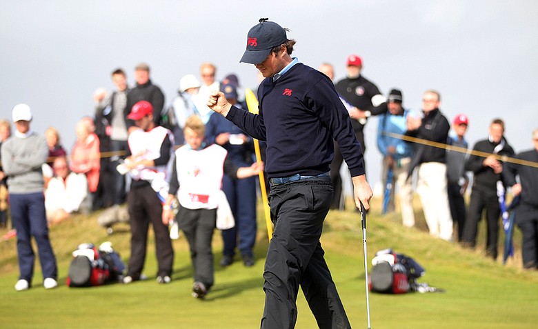 Alan Dunbar of Great Britain and Ireland celebrates after sinking a putt on No. 17 during the Day 2 morning foursomes matches of the 2011 Walker Cup held on the Balgownie Links at Royal Aberdeen Golf Club on September 11, 2011 in Aberdeen, Scotland.