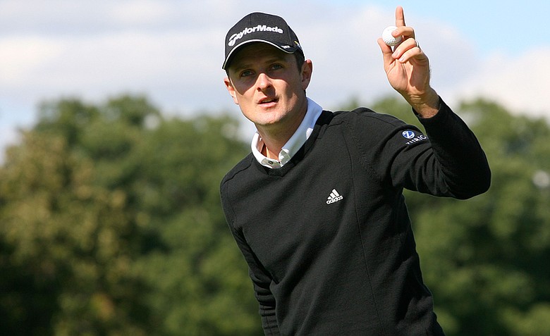 Justin Rose of England reacts after a birdie putt on the ninth hole during the first round of the BMW Championship at Cog Hill Golf & Country Club on September 15, 2011 in Lemont, Illinois. Rose fired an 8-under 63 to take a two-shot lead over Webb Simpson.