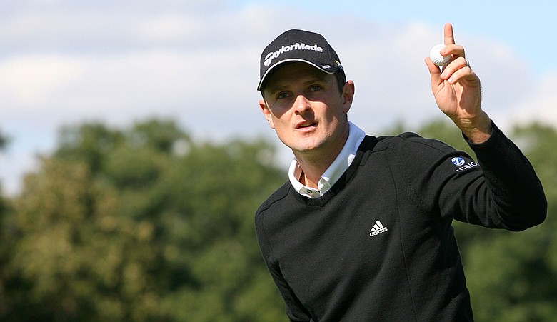 Justin Rose reacts after a birdie putt on the ninth hole during the first round of the BMW Championship at Cog Hill Golf & Country Club.