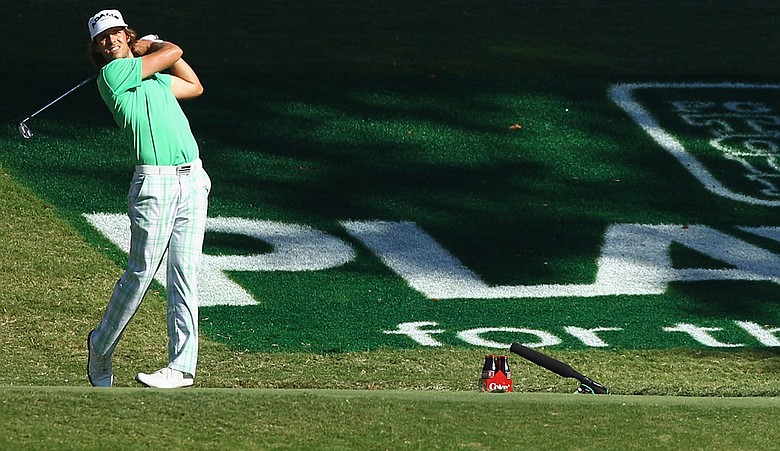 Aaron Baddeley watches his tee shot on the 18th hole during the third round of the Tour Championship at East Lake Golf Club.