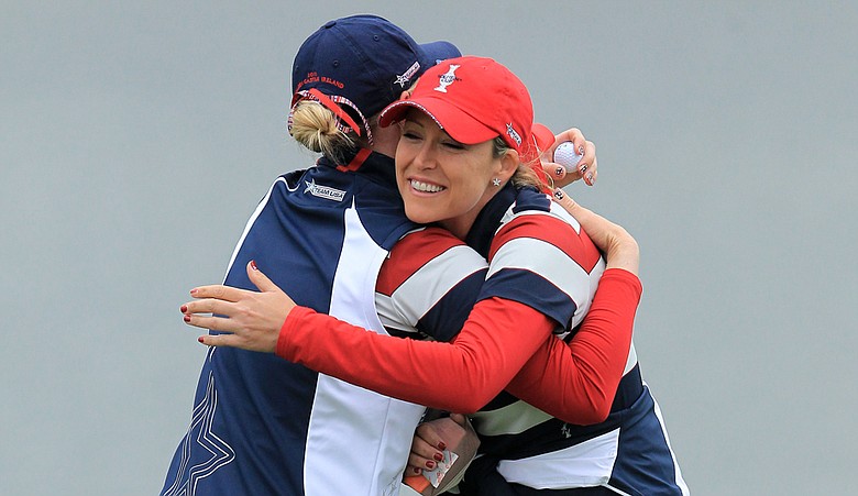 Cristie Kerr hugs Morgan Pressel after Pressel won her Solheim Cup singles match.