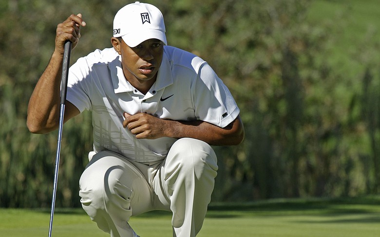Tiger Woods lines up a putt during the third round of the Frys.com Open at CordeValle.