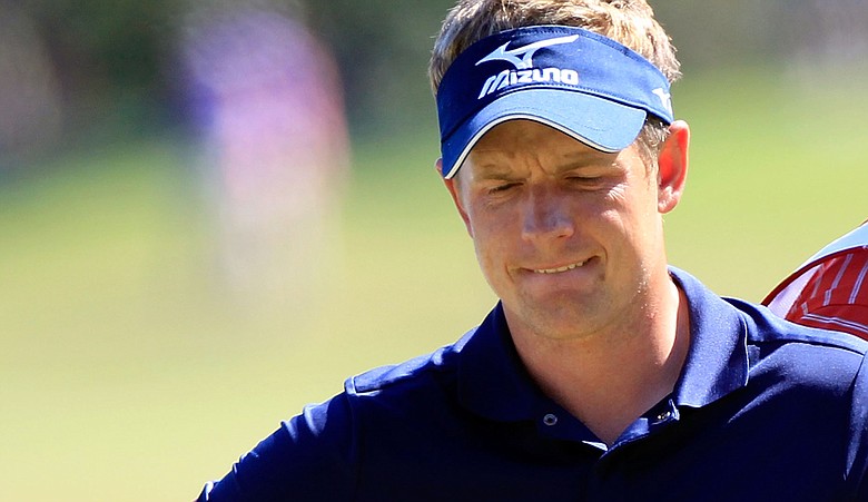 Luke Donald looks over a shot on the sixth hole during the second round of the Children's Miracle Network Classic.