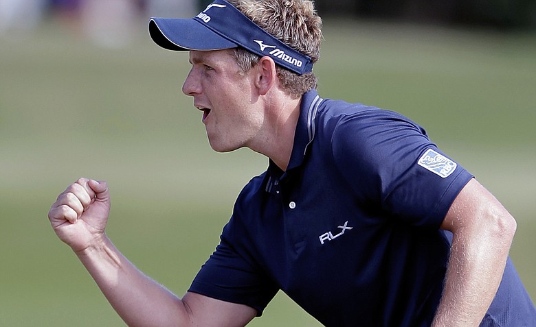 Luke Donald reacts after sinking a birdie putt on the 15th hole during the final round of the Children's Miracle Network Classic. Firing a final-round 64, Donald went on to win by two, clinching the PGA Tour money title.