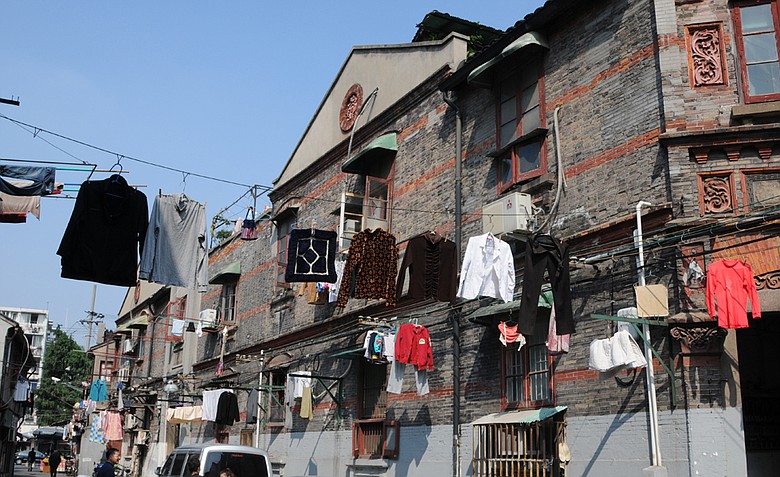 A typical street in Old Town Shanghai with the clothes drying from high above.