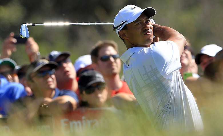 Tiger Woods hits his tee shot on the 18th hole during day two of the 2011 Australian Open.