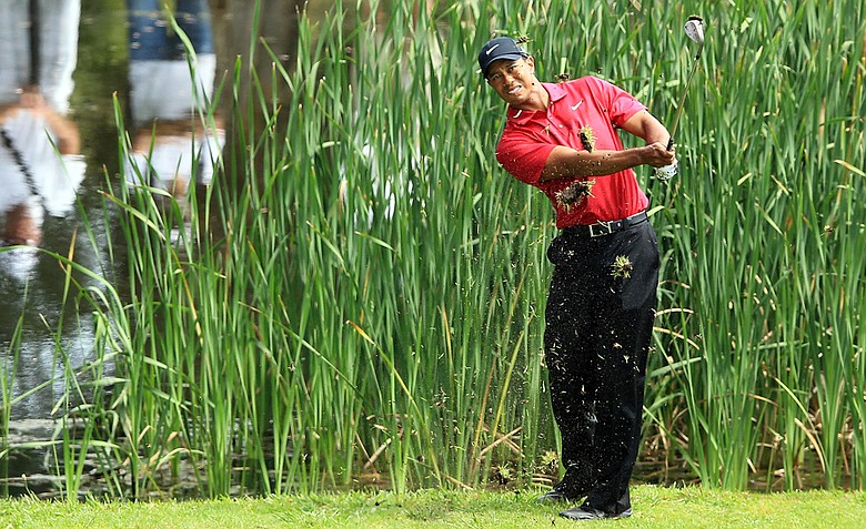 Tiger Woods follows his third shot on the par-4 13th hole during Day 4 of the Australian Open.