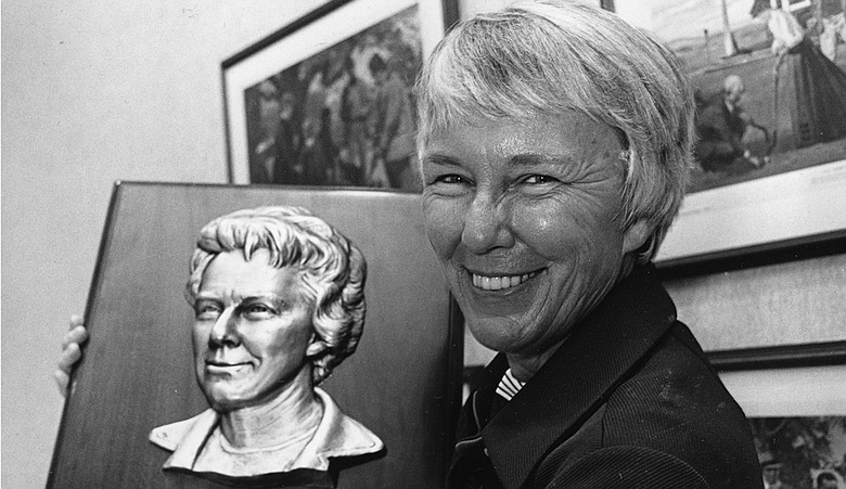 Mary "Mickey" Wright holds a World Golf Hall of Fame plaque bearing her likeness in Pinehurst, N.C., where she was inducted into the Hall of Fame, Sept. 8, 1976.