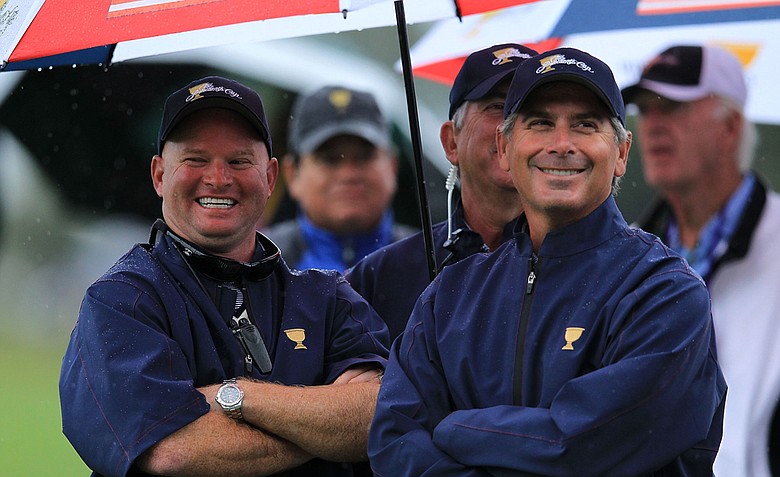 U.S. team captain Fred Couples, right, watches play during the Day Three morning foursome matches of the 2011 Presidents Cup. The U.S. ran out to a 11-6 lead after the foursomes.