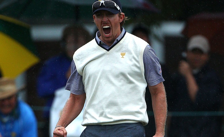 Hunter Mahan of the U.S. celebrates making a putt to win the match during the Day Three afternoon four-ball matches of the 2011 Presidents Cup.
