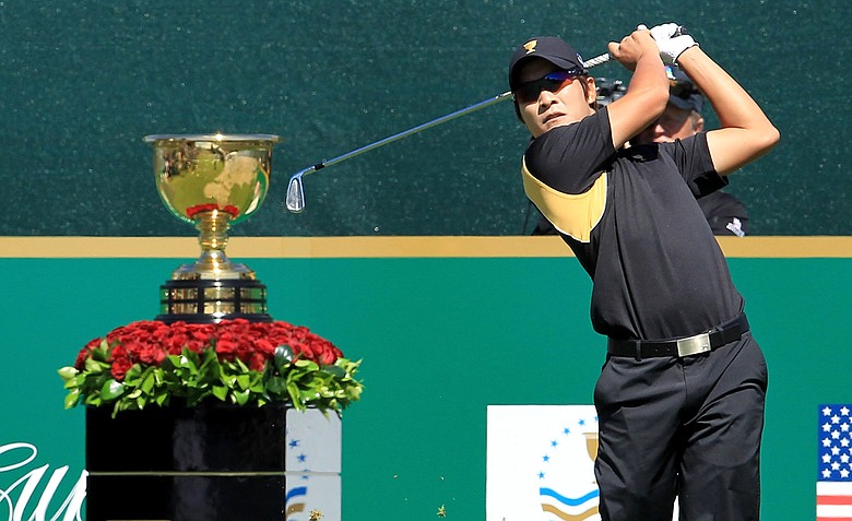 K.T. Kim of the International team plays his tee shot on the 1st hole during the Day Four singles matches of the 2011 Presidents Cup.