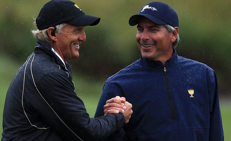International captain Greg Norman shakes hands with U.S. captain Fred Couples after the Day Three afternoon four-ball matches at the 2011 Presidents Cup.
