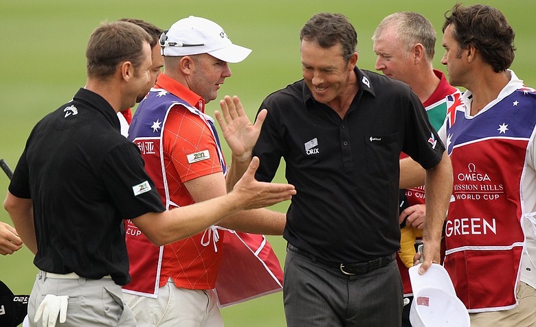 Richard Green and playing partner Brendan Jones of Australia celebrate on the 18th green during the first-day fourballs at the Omega Mission Hills World Cup.