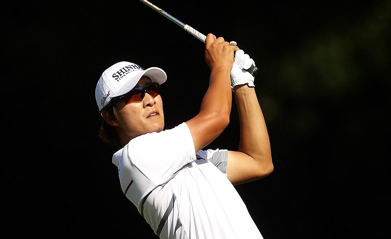 Kyung-Tae Kim plays a shot on the 16th hole during day three of the 2011 Australian PGA Championship.