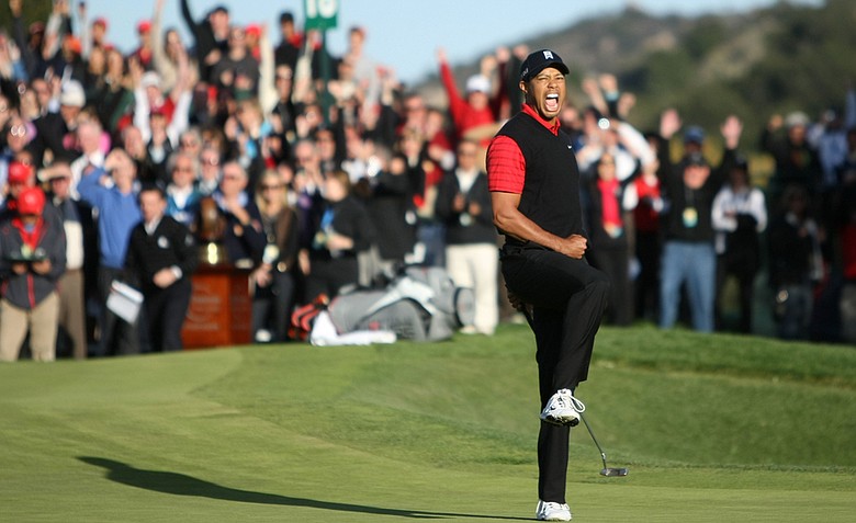 Tiger Woods celebrates after his birdie putt on the 18th hole to win the Chevron World Challenge.