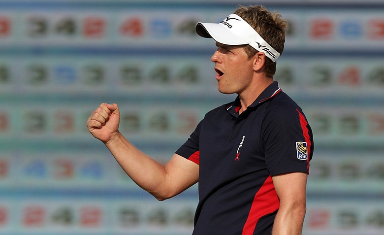 Luke Donald celebrates on the 17th green after making a birdie during the final round of the Dubai World Championship.