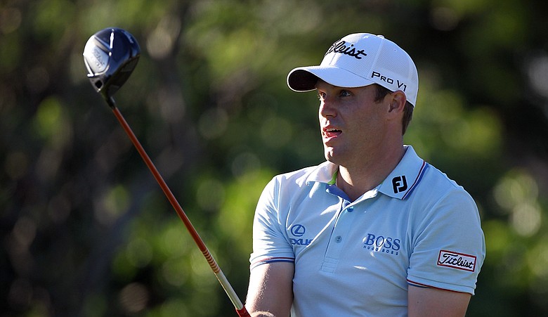 Nick Watney plays a shot on the 14th hole during the first round of the Hyundai Tournament of Champions.