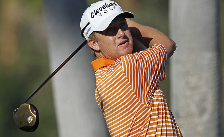 David Toms watches his tee shot on the first hole during the first round of the Humana Challenge.
