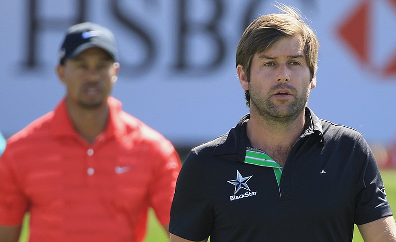 Robert Rock, right, and Tiger Woods traded early birdies, but Rock was able to stay steady for the entire round.