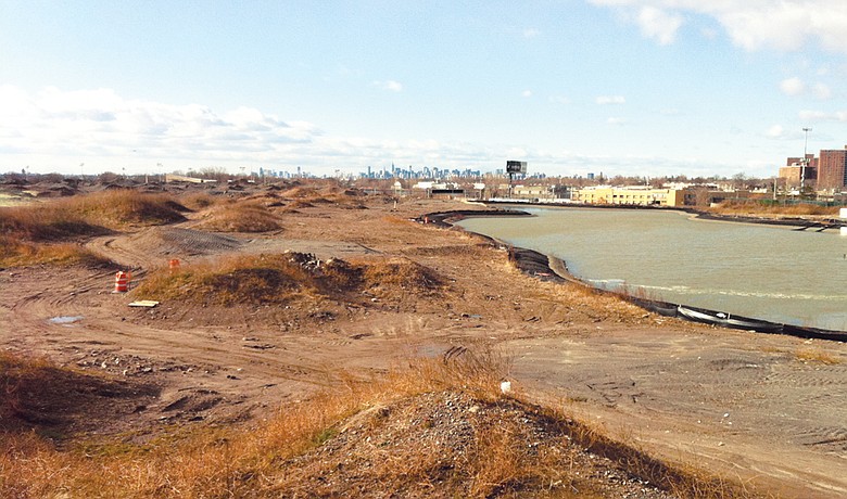 The New York skyline forms the backdrop for what would be the short par-4 seventh hole at Ferry Point.