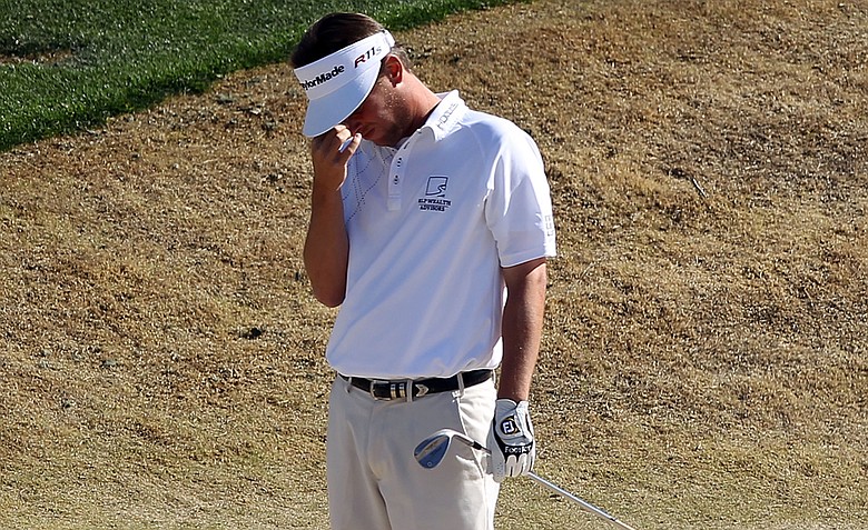 Spencer Levin reacts after a chip onto the 12th hole green during the final round of the Waste Management Phoenix Open at TPC Scottsdale.