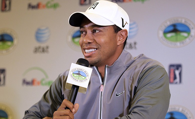 Tiger Woods talks to reporters during a news conference at the AT&T Pebble Beach National Pro-Am golf tournament in Pebble Beach.