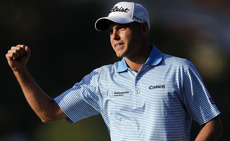 Bill Haas celebrates after winning the Northern Trust Open golf tournament on the second playoff hole at Riviera Country Club.