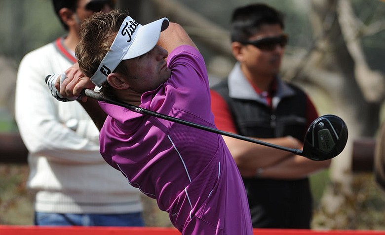Jbe Kruger of South Africa plays a shot during the final round of the Avantha Masters 2012 at the DLF Golf and Country Club.