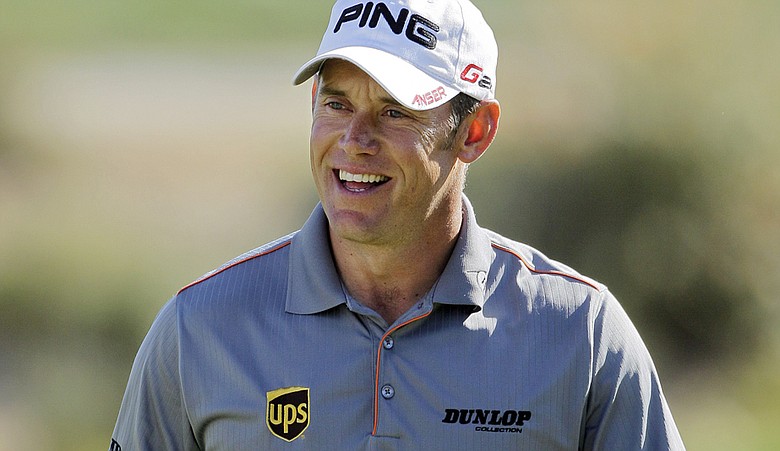 Lee Westwood smiles after chipping onto the 16th green while playing Martin Laird during the WGC-Match Play Championship.