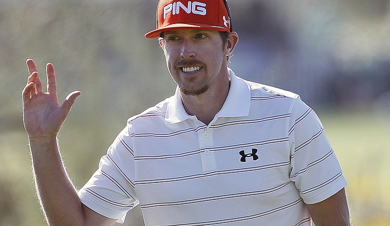 Hunter Mahan waves to spectators during the championship match of the WGC-Accenture Match Play Championship.