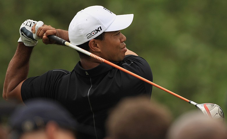 Tiger Woods watches a shot on the third hole during first round of the World Golf Championships-Cadillac Championship on the TPC Blue Monster at Doral.