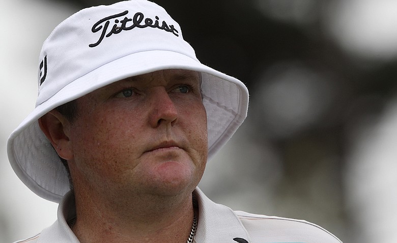 Australia's Jarrod Lyle watches his ball on the 18th hole during the first round of the Australian Open.