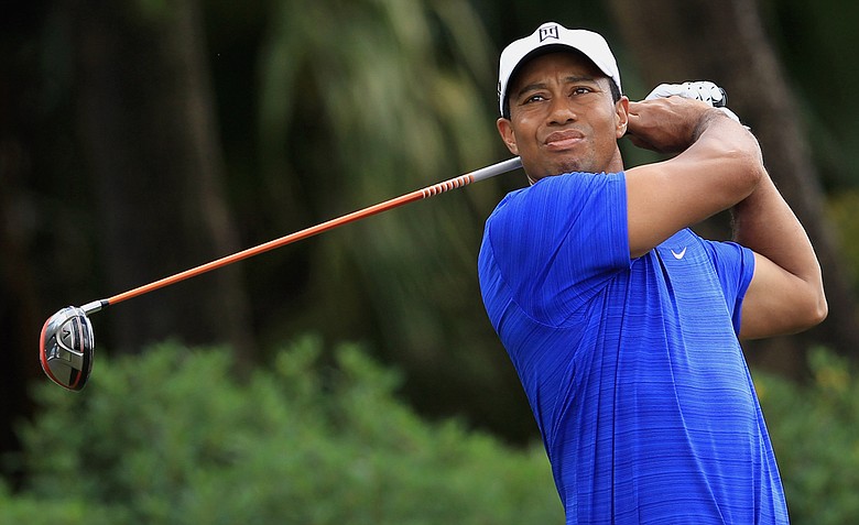 Tiger Woods watches his tee shot on the 12th hole during the second round of the WGC-Cadillac Championship at Doral.
