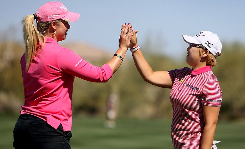 Jiyai Shin gets a high five from Brittany Lincicome after she made birdie at No. 9 to take the lead during the first round of the RR Donnelley Founders Cup.