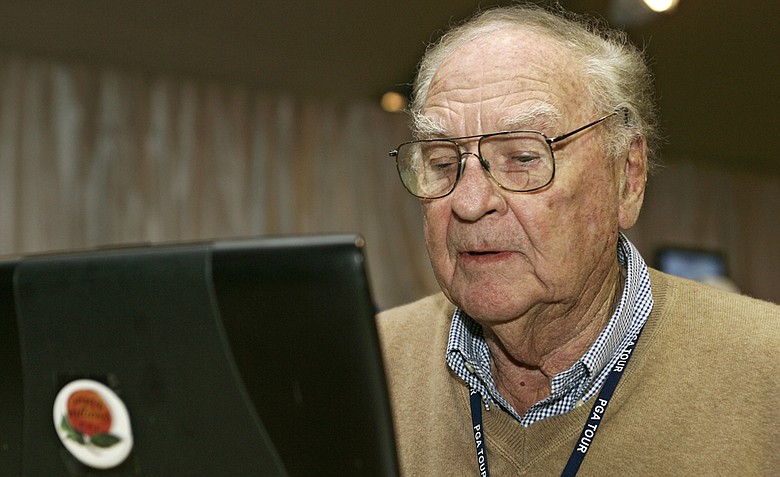 Furman Bisher of the Atlanta Journal Constitution celebrates his 88th birthday while covering the third round of the THE TOUR Championship at East Lake Golf Club in Atlanta, Georgia, on November 4, 2006.