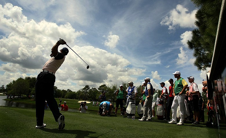 Tiger Woods hits his tee shot at No. 7 on Tuesday, March 20, during the 2012 Tavistock Cup at Lake Nona Golf and Country Club. Woods is part of Team Albany.