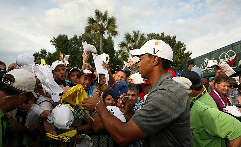 Tiger Woods signs autographs during the third round of the Arnold Palmer Invitational.