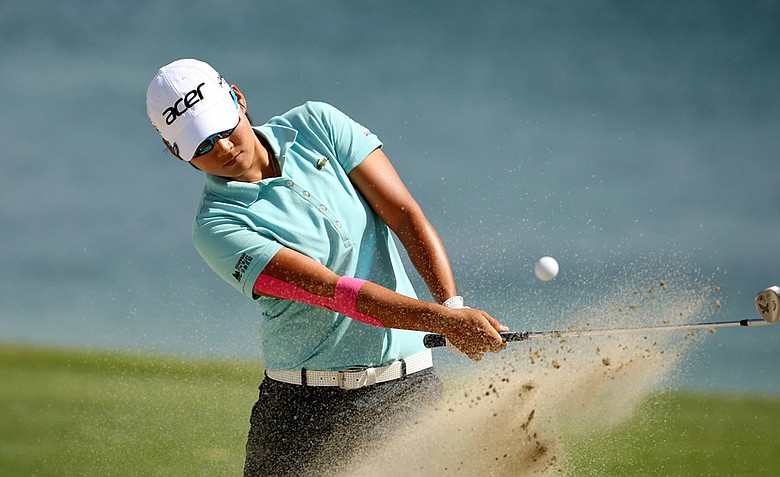 Yani Tseng hits out of the bunker at No. 6 on Saturday at the Kraft Nabisco Championship.