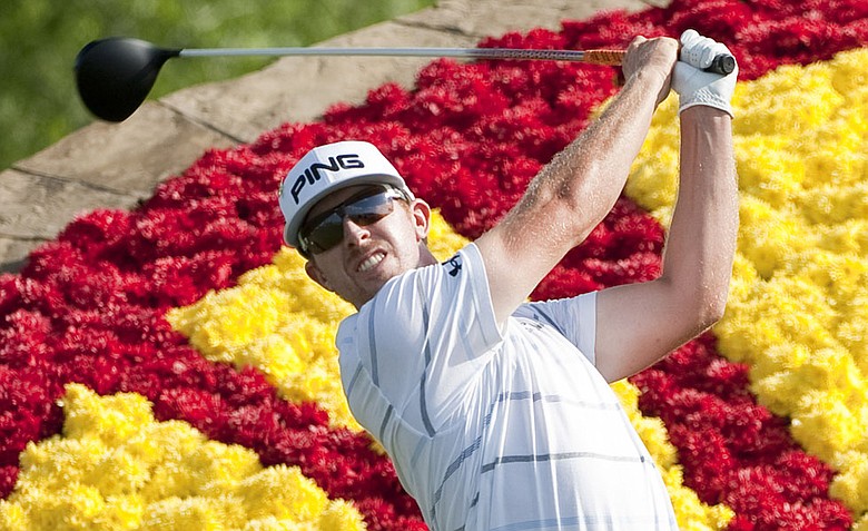 Hunter Mahan watches his tee shot on the 18th hole during the final round of the Houston Open.