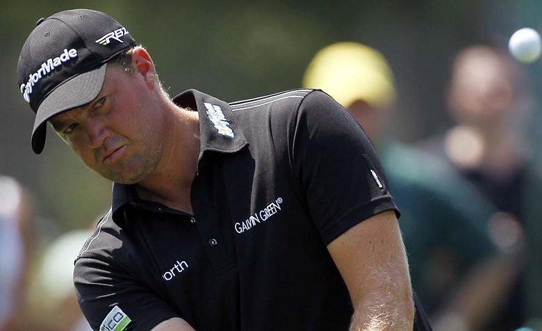 Peter Hanson chips a pitch shot during a practice round for the Masters.